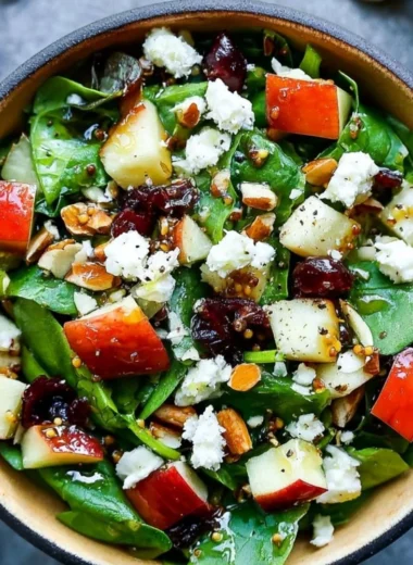 Cozy apple almond feta spinach salad with fresh ingredients
