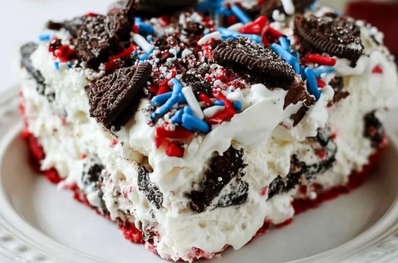 No bake Fireworks Oreo Cheesecake Bars topped with colorful sprinkles.