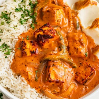 Delicious Cottage Cheese Tikka Curry garnished with herbs and spices