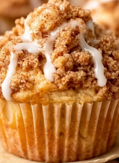 Freshly baked cozy apple crumble muffins with a crispy topping