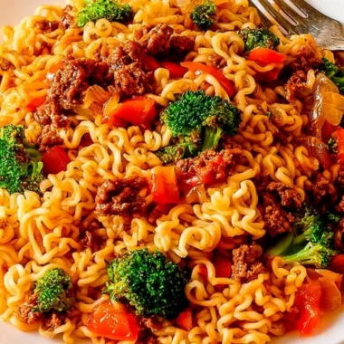 Cozy beef ramen noodles stir fry in a bowl with fresh vegetables