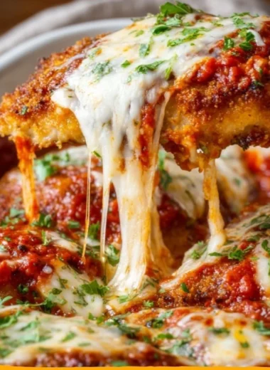 Cozy classic chicken parmesan served with pasta and fresh basil