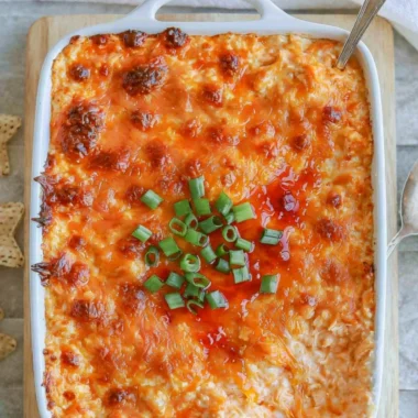 Cozy Cottage Cheese Buffalo Chicken Dip served in a bowl with crackers