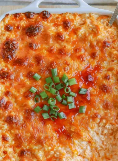 Cozy Cottage Cheese Buffalo Chicken Dip served in a bowl with crackers