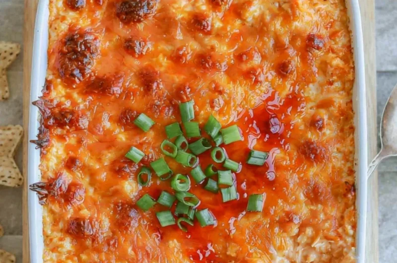 Cozy Cottage Cheese Buffalo Chicken Dip served in a bowl with crackers