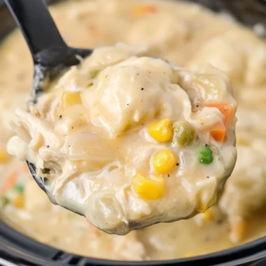 Delicious crock pot chicken and dumplings served in a bowl.