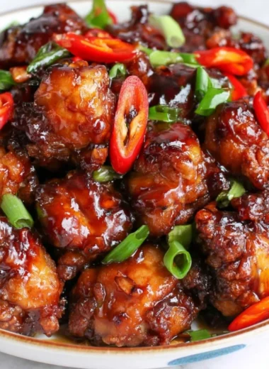 A delicious plate of Cozy Mongolian Chicken served with vibrant vegetables and rice.