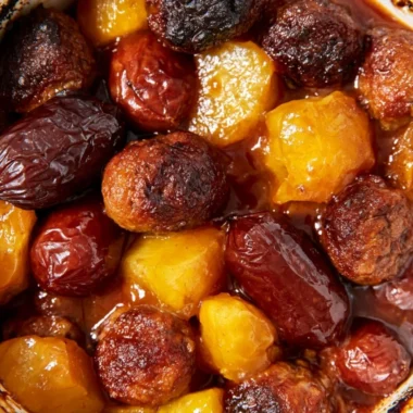Delicious slow cooker meatball pineapple smokies served in a bowl.