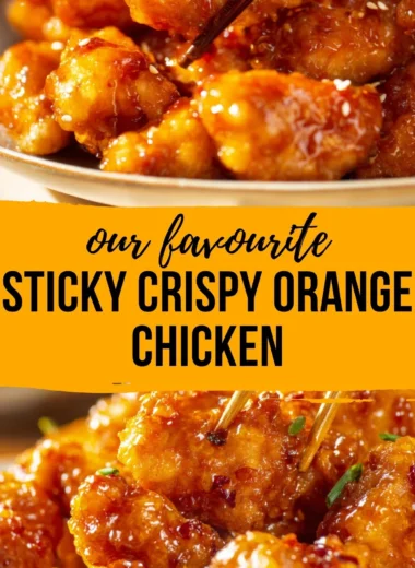 Plate of crispy orange chicken garnished with green onions and sesame seeds