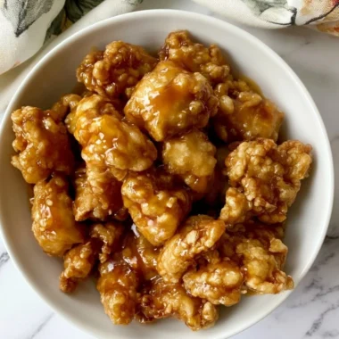 Delicious Panda Express orange chicken served with rice and vegetables
