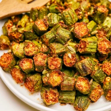 Delicious roasted okra served on a plate, showcasing its vibrant color and texture.
