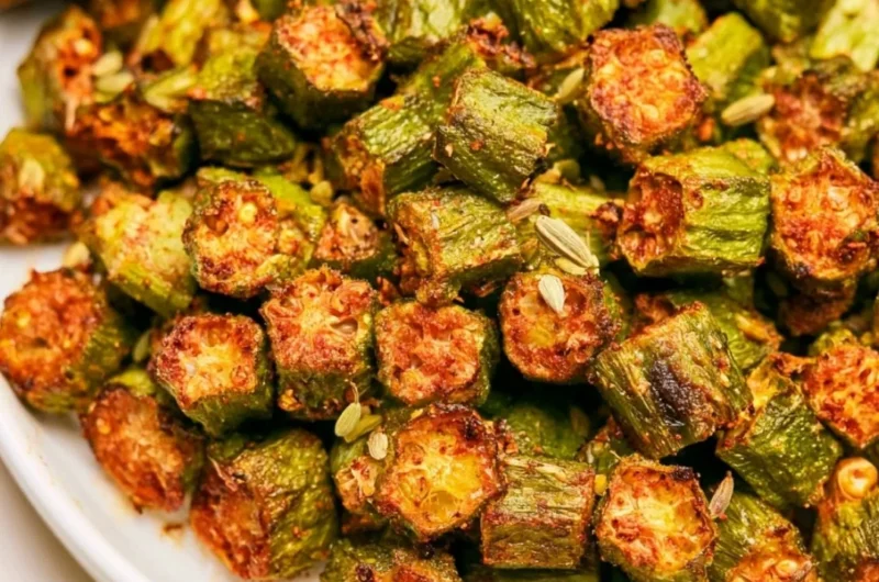 Delicious roasted okra served on a plate, showcasing its vibrant color and texture.