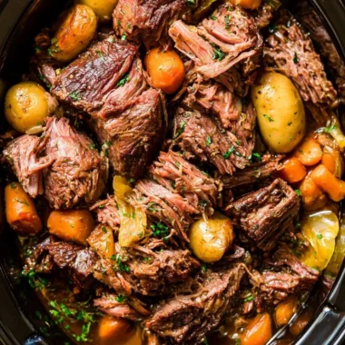 Tender chuck roast simmered in a crock pot for comforting home-cooked meals.