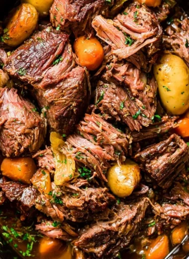 Tender chuck roast simmered in a crock pot for comforting home-cooked meals.