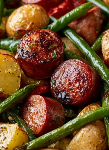 One pan meal featuring sausage, green beans, and potatoes cooked together.