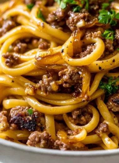 Delicious garlic butter beef pasta served in a cozy setting.