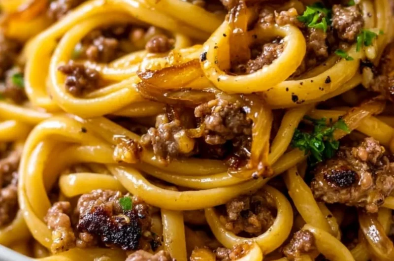 Delicious garlic butter beef pasta served in a cozy setting.