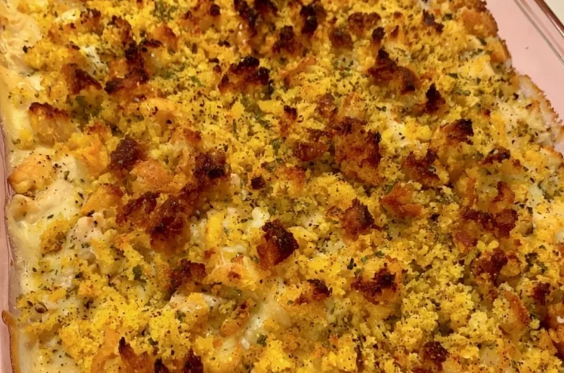 Delicious easy chicken dressing casserole served in a baking dish