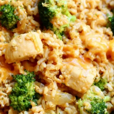 One-Pot Chicken and Rice dish served in a bowl with herbs on top