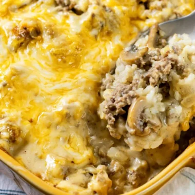 Cheesy ground beef and rice casserole served in a baking dish