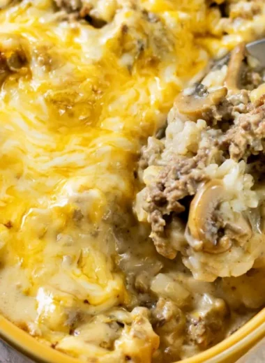 Cheesy ground beef and rice casserole served in a baking dish