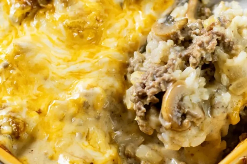 Cheesy ground beef and rice casserole served in a baking dish