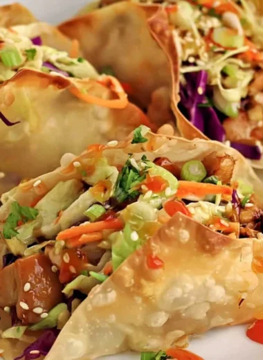 Crispy Chicken Wonton Tacos served with fresh toppings and sauces