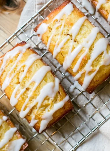 Delicious Eggnog Bread topped with a sweet sugar rum glaze, a festive holiday treat.