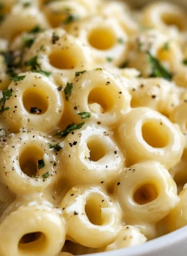 Delicious garlic butter pasta dish with fresh herbs and Parmesan cheese
