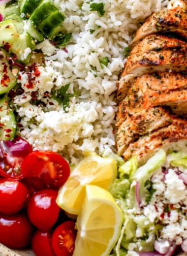 Greek chicken bowls with fresh vegetables and herbs