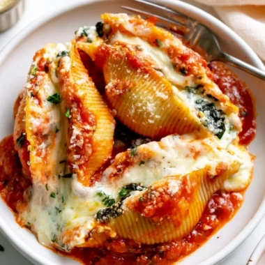Delicious stuffed shells topped with marinara sauce and cheese