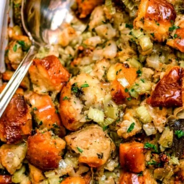 Bowl of traditional Thanksgiving stuffing with herbs and vegetables ready to serve
